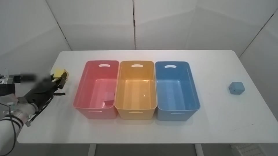 Two robot grippers sorting colored blocks into containers